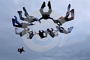 A group of skydivers. Formation skydiving in the sky.