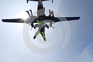 A group of skydivers. Skydiving is in the sky.