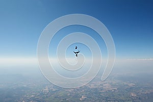 Group skydiving. Team jump. Skydivers are in the sky.