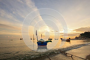 Group of small fishing boats at coast in morning ; Songkhla province, Thailand