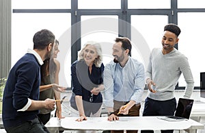 Group of smiling business people busy discussing