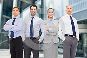 Group of smiling businessmen outdoors