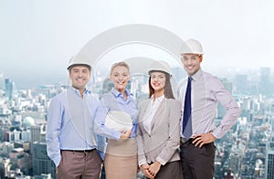 Group of smiling businessmen in white helmets