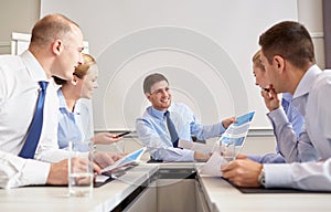 Group of smiling businesspeople meeting in office