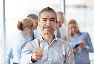 Group of smiling businesspeople meeting in office