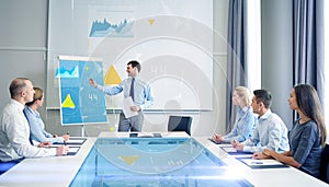 Group of smiling businesspeople meeting in office