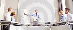 Group of smiling businesspeople meeting in office