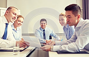 Group of smiling businesspeople meeting in office