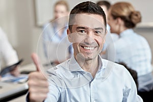 Group of smiling businesspeople meeting in office