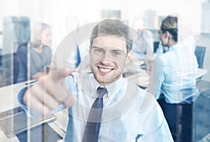 Group of smiling businesspeople meeting in office