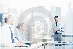 Group of smiling businesspeople meeting in office