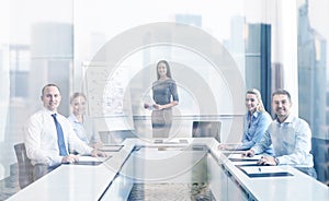 Group of smiling businesspeople meeting in office