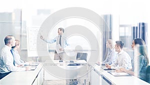 Group of smiling businesspeople meeting in office