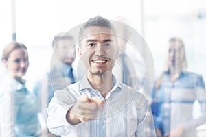 Group of smiling businesspeople meeting in office