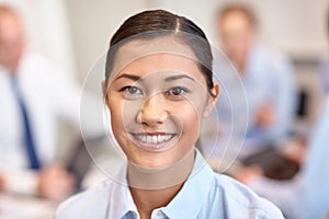 Group of smiling businesspeople meeting in office