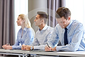 Group of smiling businesspeople meeting in office