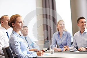 Group of smiling businesspeople meeting in office