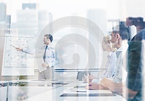 Group of smiling businesspeople meeting in office