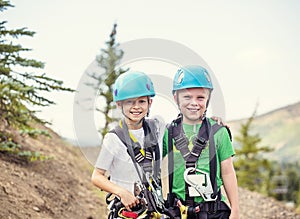 Group of smiling Children ready to go on a zip line adventure