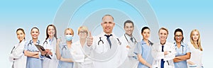 Group of smiling doctors with showing thumbs up
