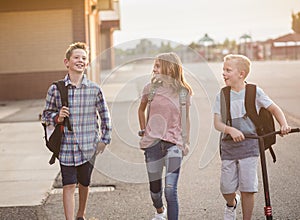 Group of smiling elementary school students on their way home