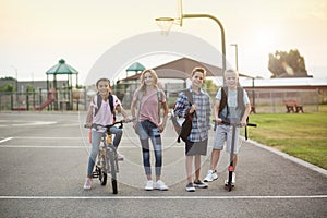 Group of smiling elementary school students on their way home