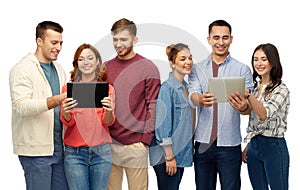 Group of smiling friends with tablet computers