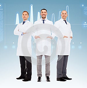 Group of smiling male doctors in white coats