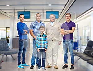 Group of smiling men and boy