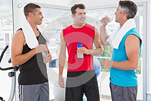 Group of smiling men talking each other