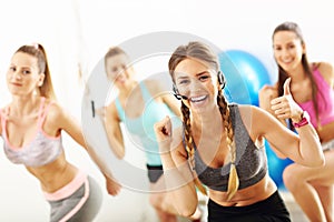 Group of smiling people doing aerobics