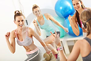 Group of smiling people doing aerobics