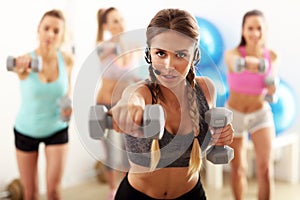 Group of smiling people doing aerobics