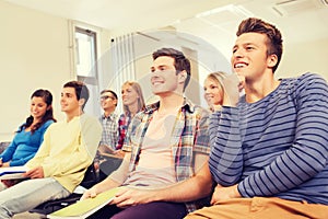 Group of smiling students in lecture hall