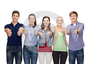 Group of smiling students showing thumbs up