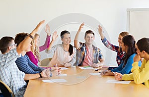 Group of smiling students voting