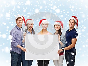 Group of smiling students with white blank board