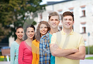 Group of smiling teenagers over campus background