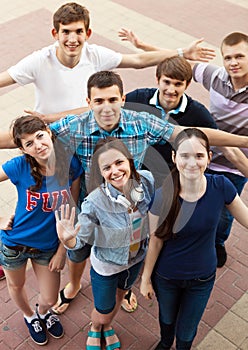 Group of smiling teenagers standing outdoors