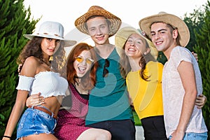 Group of smiling young party friends fooling around photo