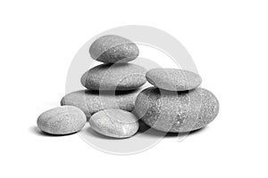 Group of smooth grey stones. Sea pebble. Stacked pebbles isolated on white background