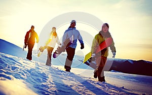 Group of Snowboarders on Top of the Mountain Concept