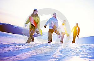 Group of Snowboarders on Top of the Mountain Concept