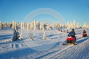 Group of snowmobiles in Lapland, near Saariselka Finland