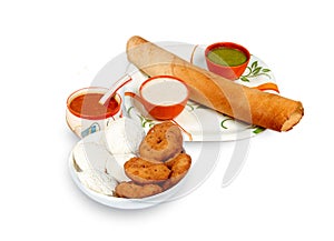 Group of South Indian food like Paper Masala Dosa dhosa, Idli or idly, Wada or vada Medu Vada, sambhar, sambar and coconut