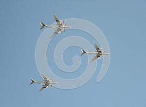 The group of Soviet strategic bomber Tupolev Tu-95 `Bear` flies over Red Square. Dress rehearsal of the Victory Day parade on Red photo