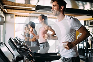 Group of sportive people in a gym. Concepts about lifestyle and sport in a fitness club