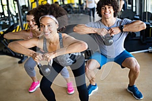 Group of sportive people in a gym training