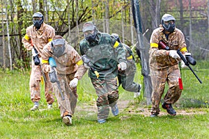 Group of sportsmen on start of paintball mission