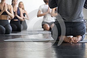 Group of sporty people in vajrasana exercise, close up